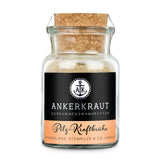 Pilzbrühe von Ankerkraut im Korkenglas auf weißem Hintergrund.